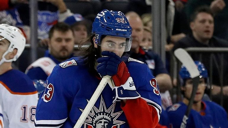 Mika Zibanejad #93 of the Rangers looks on after the Edmonton...