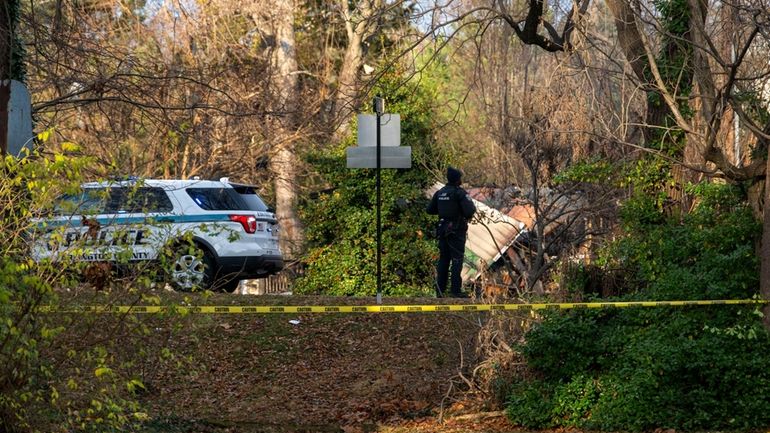 A member of the Arlington County Police Department looks towards...