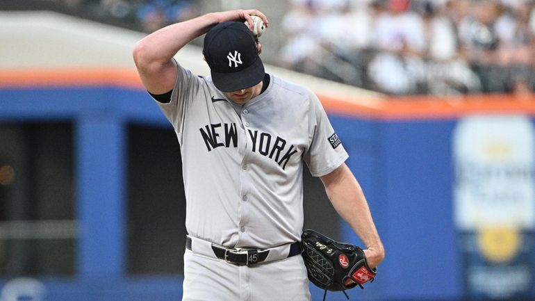 Yankees starting pitcher Gerrit Cole reacts against the New York...