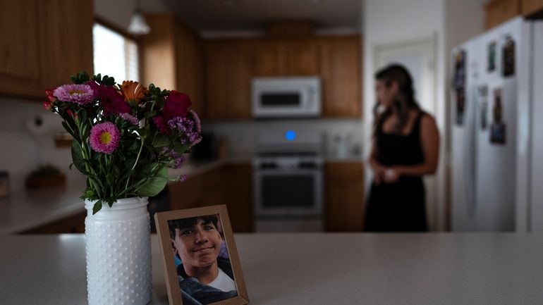 A framed photo of Elijah Ott, who died of a...