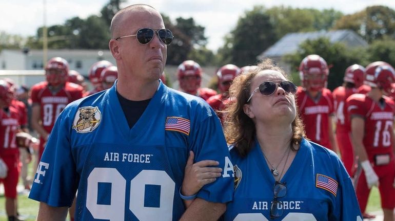 David and Regina Stagliano watch a flyover during a pregame...