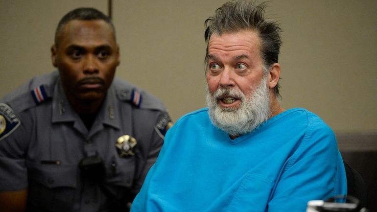 Robert Dear talks to Judge Gilbert Martinez during a court...