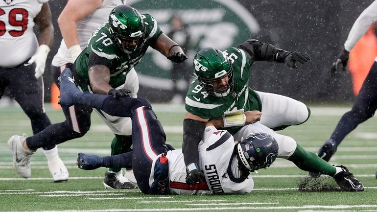 Solomon Thomas of the Jets sacks C.J. Stroud of the...