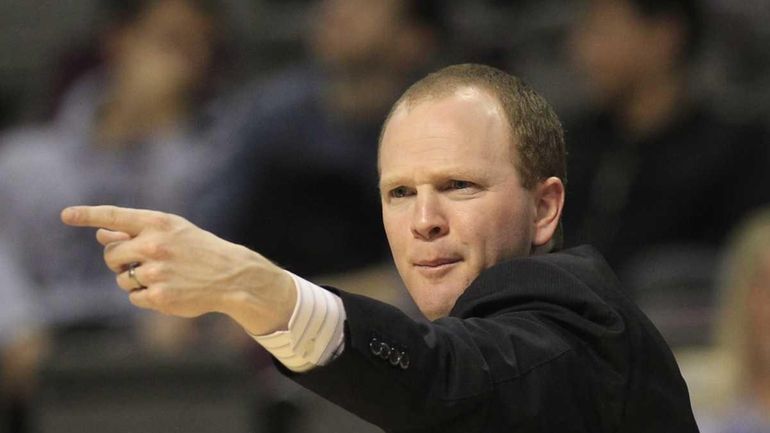 Detroit Pistons head coach Lawrence Frank signals from the sidelines...