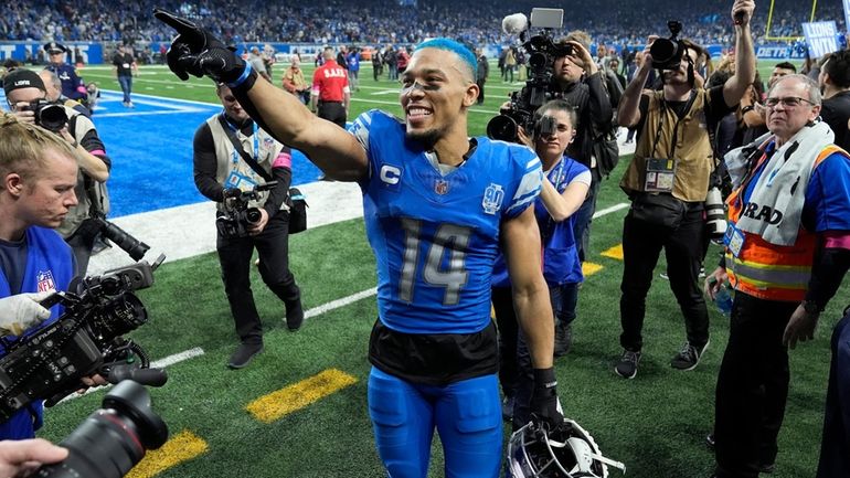 Detroit Lions wide receiver Amon-Ra St. Brown leaves the field...