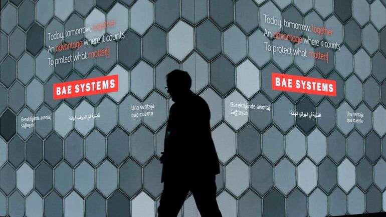 A man walks past a screen in the BAE Systems...