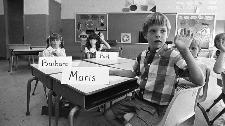 From left, first-graders Barbara Erickson, Beth Maloney and Maris Abolins at...