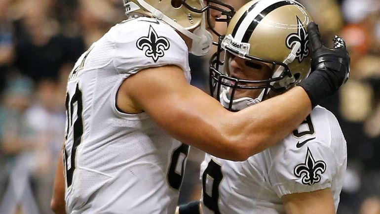 New Orleans Saints tight end Jimmy Graham celebrates with quarterback...