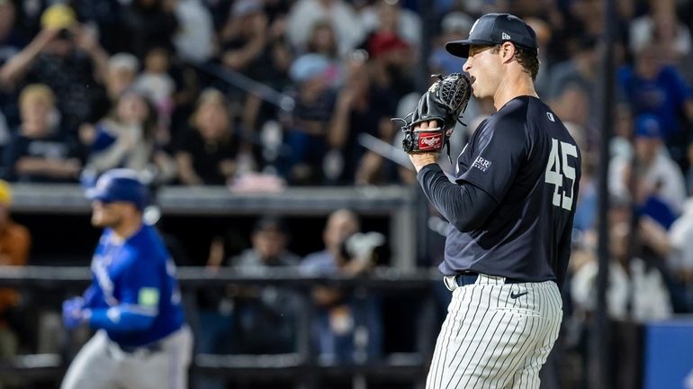 Yankees starting pitcher Gerrit Cole gives up a two-run homer to...