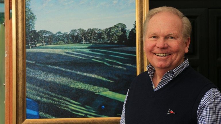 Golf artist George Lawrence poses with a print of his...