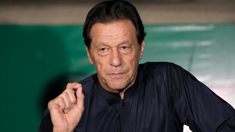 Pakistan's former Prime Minister Imran Khan gives a press conference...