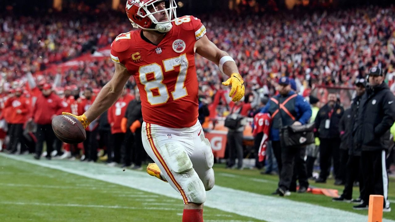 FILE - San Francisco 49ers tight end George Kittle (85) catches a touchdown  pass against the Arizona Cardinals during the first half of an NFL football  game in Santa Clara, Calif., Jan.