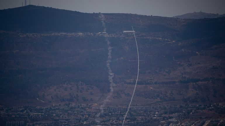 The Israeli Iron Dome air defense system fires to intercept...