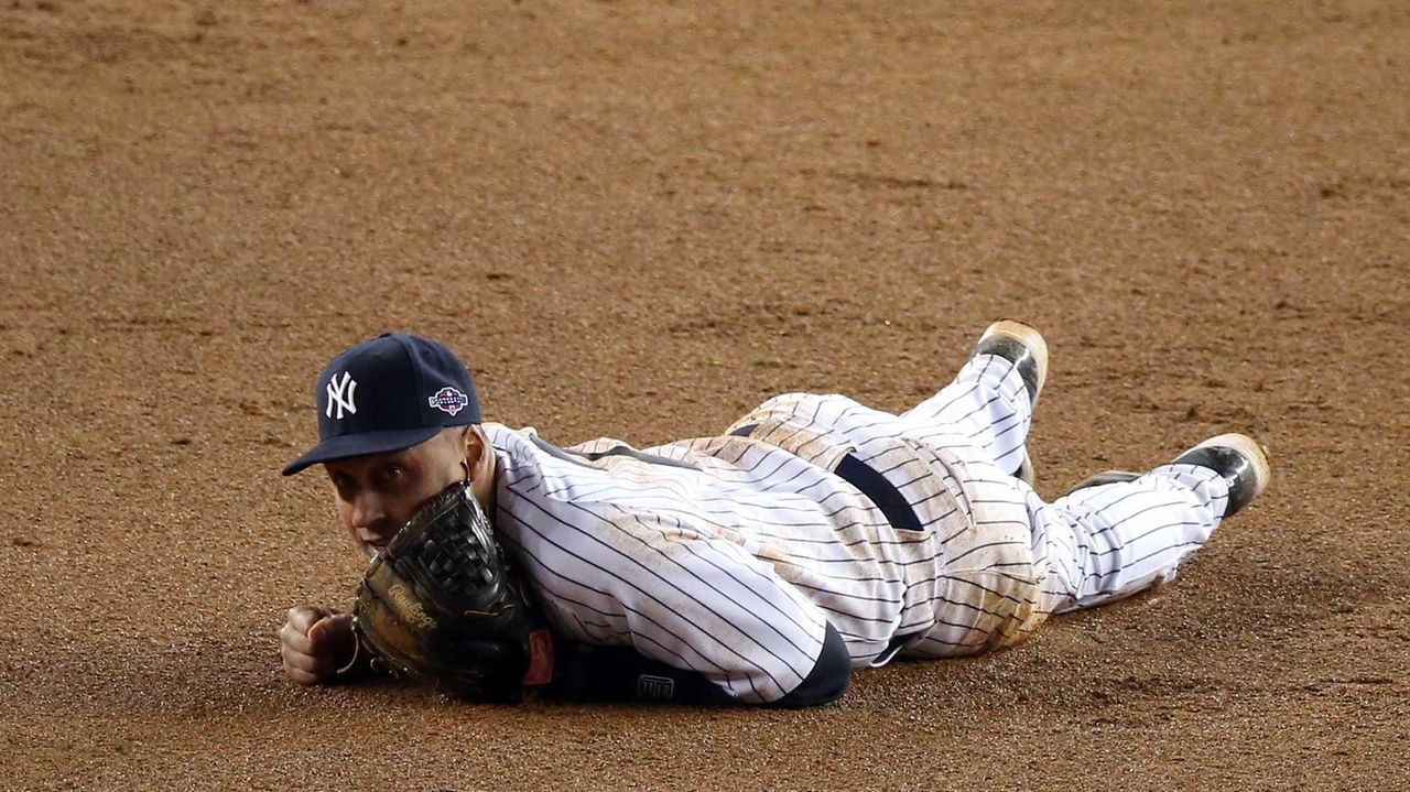 New York Yankees Derek Jeter reacts with Alex Rodriguez after