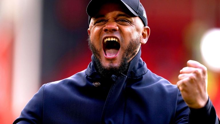 Burnley manager Vincent Kompany celebrates at the end of the...