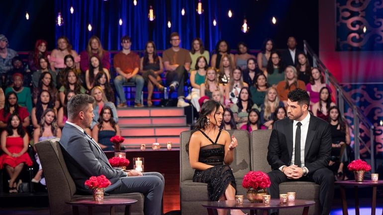 "The Bachelorette" host Jesse Palmer, from left, looks on as Jenn Tran...