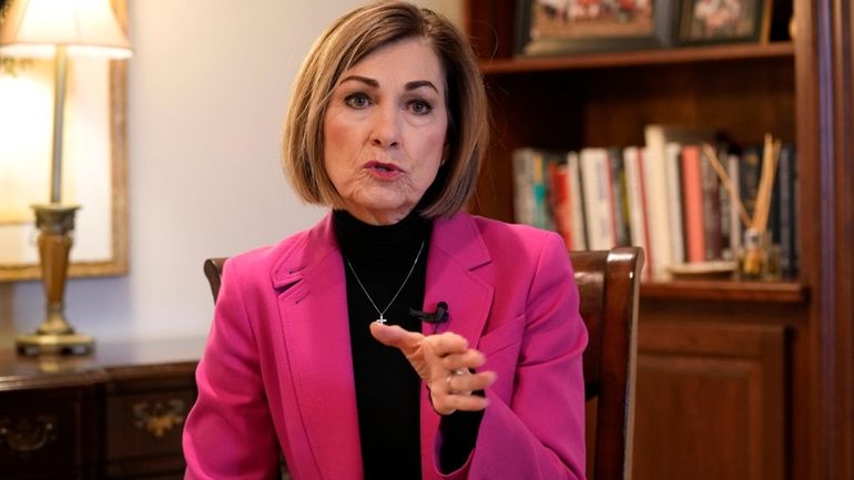 Iowa Gov. Kim Reynolds speaks during an interview with The...