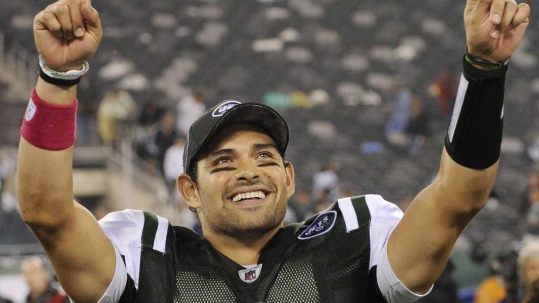 New York Jets Mark Sanchez takes off his helmet after greeting