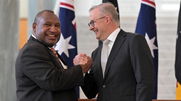 Australia's Prime Minister Anthony Albanese, right, greets Papua New Guinea's...