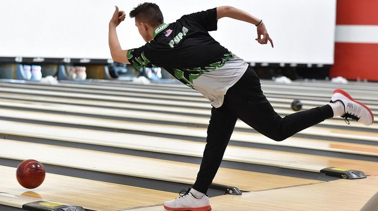 Chris Pupa of Seaford rolls during the Nassau boys bowling championship...