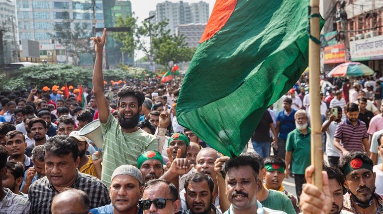 Supporters of the Bangladesh Nationalist Party (BNP) shout slogans during...