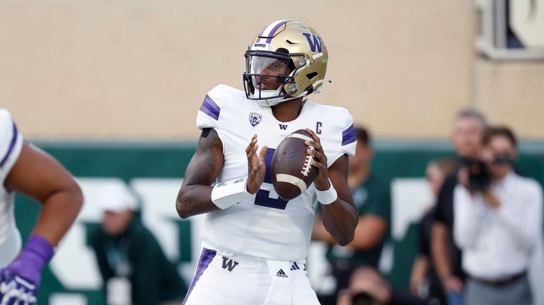 Washington quarterback Michael Penix Jr. looks to throw during the...