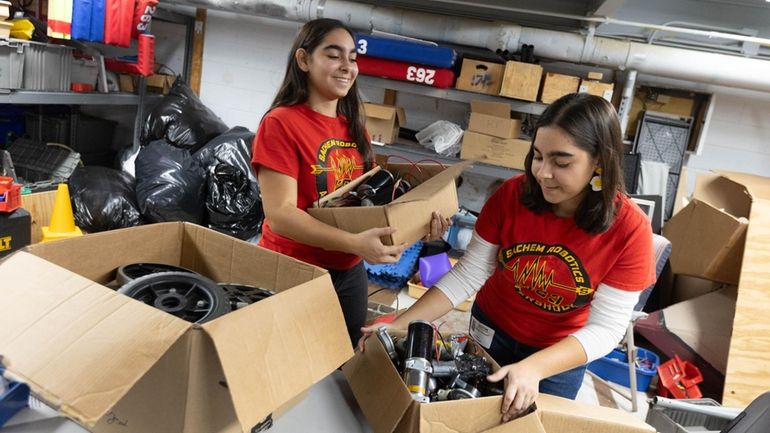 Twins Sofia left, and Stefanie Karayoff, in the robotics lab at...