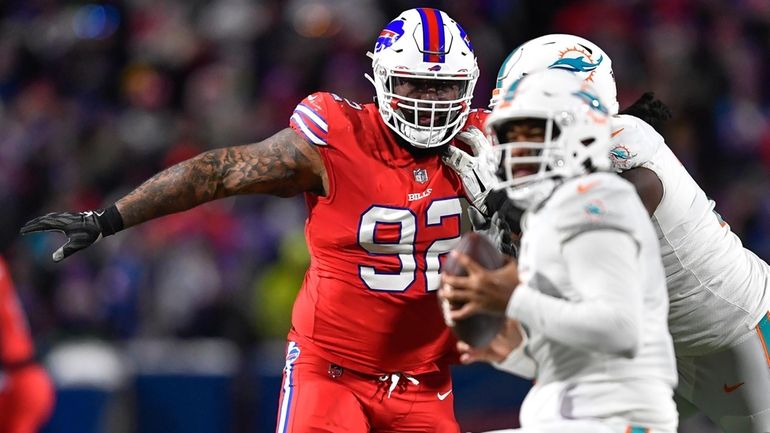 Buffalo Bills defensive tackle DaQuan Jones (92) pressures Miami Dolphins...