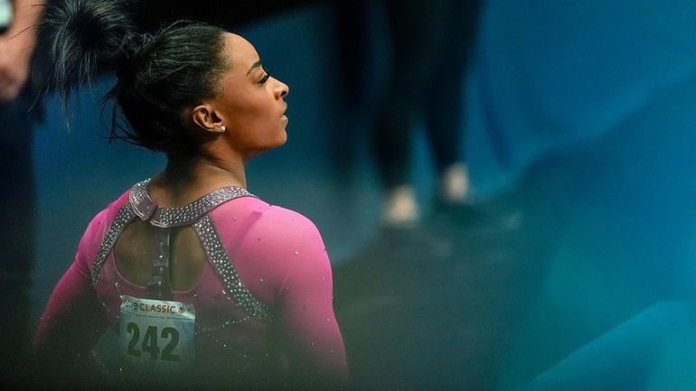 Simone Biles watches the scoreboard during the U.S. Classic gymnastics...