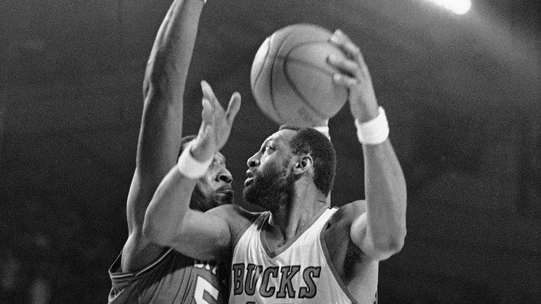 Milwaukee's Bob Lanier  moves for the basket as Philadelphia 76ers...