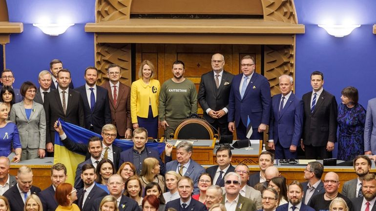 Ukrainian President Volodymyr Zelenskyy, center, with Estonia's President Alar Karis,...