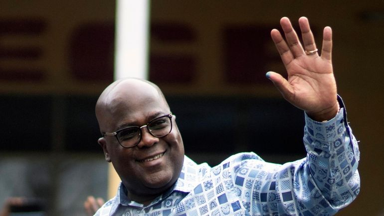 Congo's President Felix Tshisekedi waves to his supporters after casting...