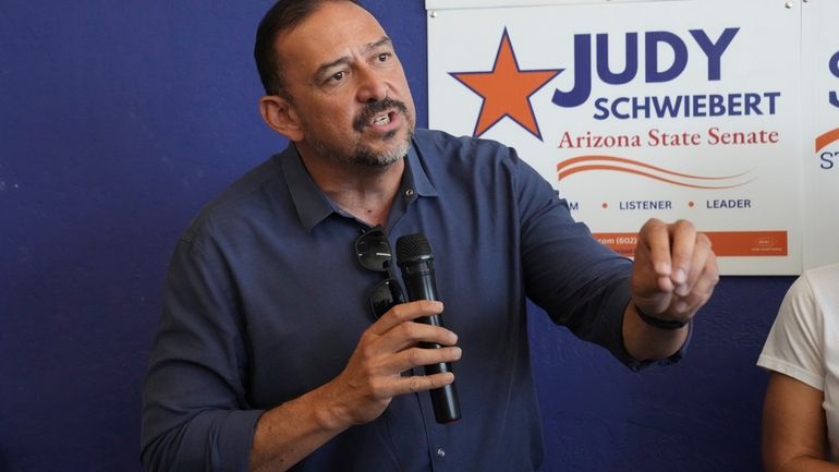 Arizona Secretary of State Adrian Fontes speaks at a campaign...