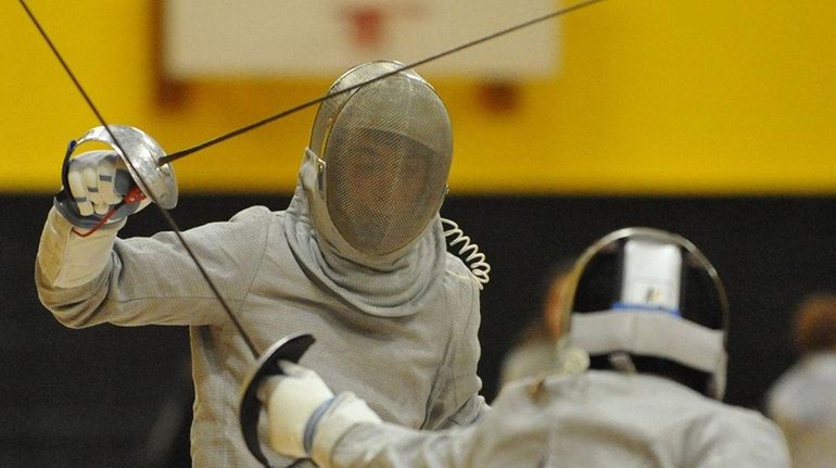 Commack's Bobby Spathis, left, and Brentwood's Emanuel Santiago duel in...