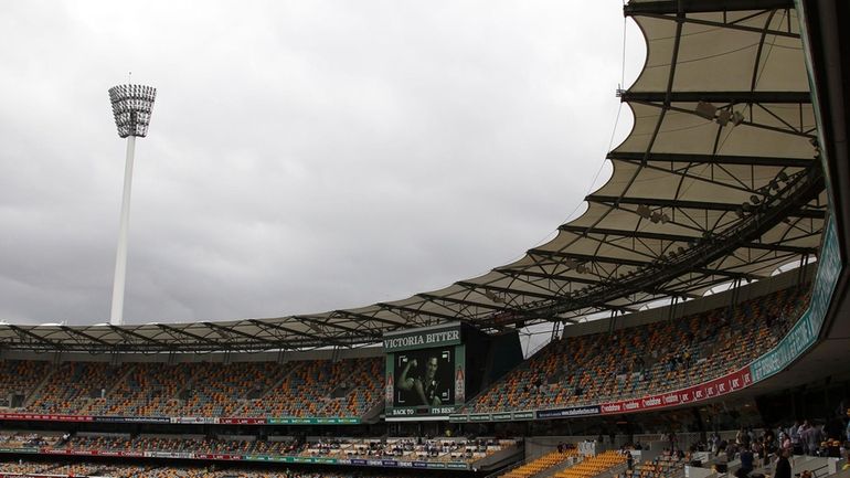 Spectators make their way home after play had been suspended...