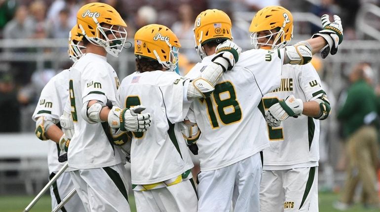 Ward Melville players celebrate a goal against Niskayuna during the...