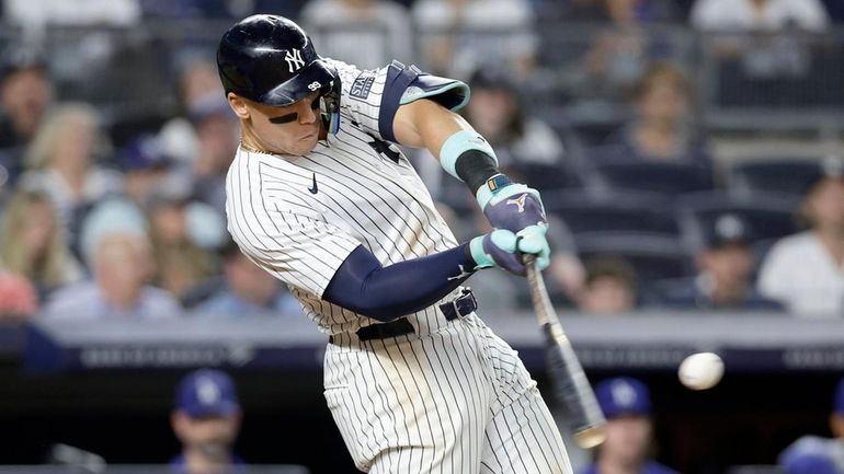 Aaron Judge of the Yankees connects on his eighth-inning home run...