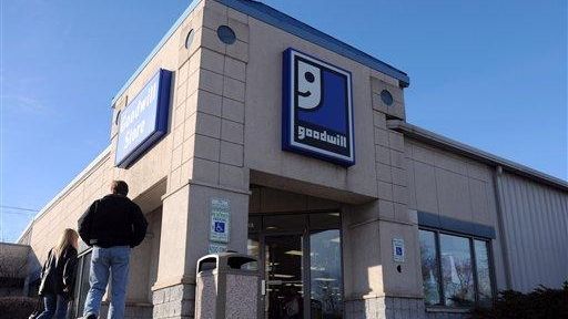 Pedestrians walk past the Goodwill store in Moline, Ill. (Nov....