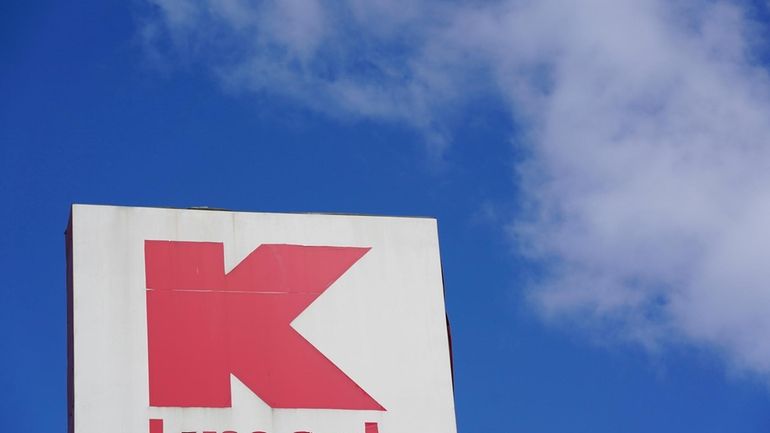 A large Kmart sign is displayed in front of a...