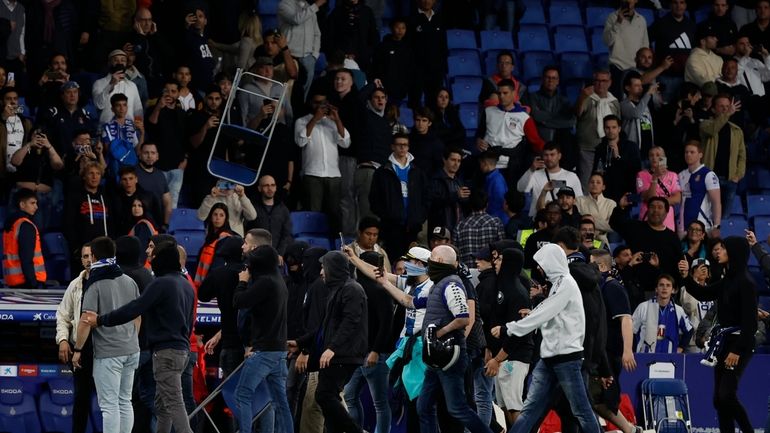 Supporters run in the file after the Spanish La Liga...