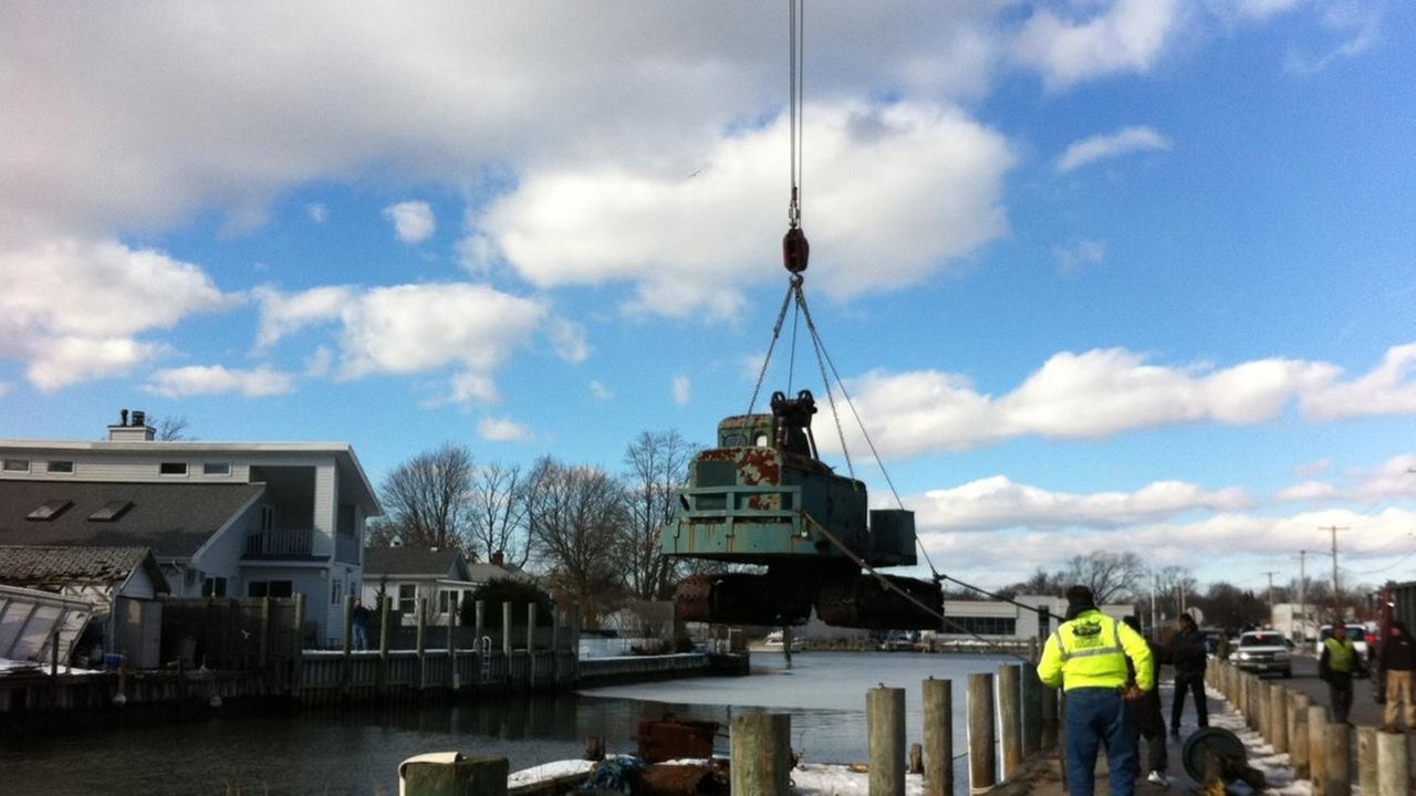 Lindenhurst extracts sunken barge, crane Newsday