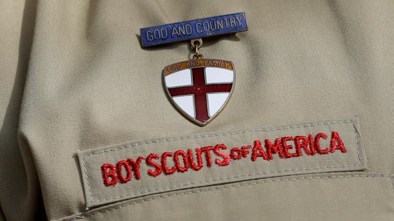 A close up of a Boy Scout uniform is photographed...