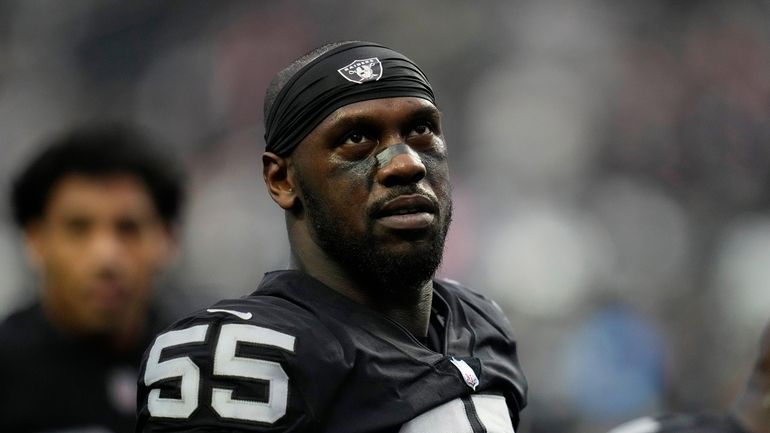 Las Vegas Raiders defensive end Chandler Jones (55) warms up...