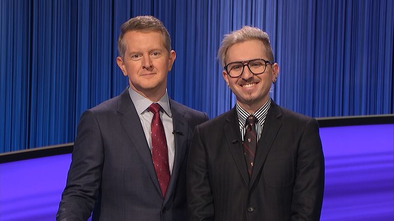 Syosset High School social studies teacher Daniel Wohl, right, with “Jeopardy!”...