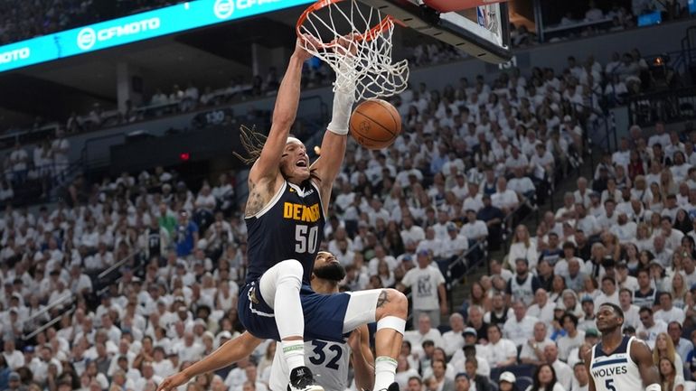 Denver Nuggets forward Aaron Gordon (50) dunks during the second...