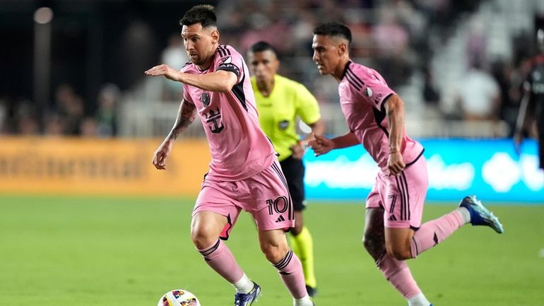 Inter Miami forward Lionel Messi (10) runs with the ball...