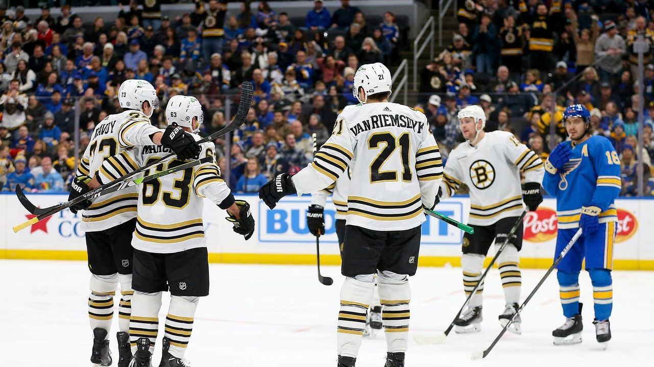 Marchand scores twice, passing 900 career points, as Boston beats St. Louis 4-3 in OT
