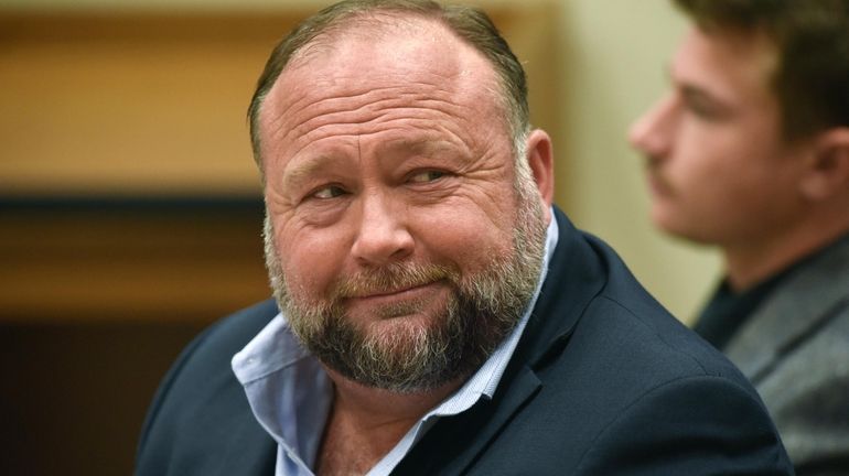 Infowars founder Alex Jones appears in court to testify during...