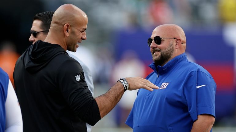 Jets head coach Robert Saleh, left, and Giants head coach Brian...