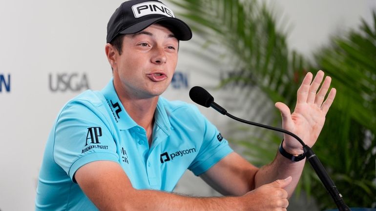 Viktor Hovland, of Norway, speaks during a news conference at...